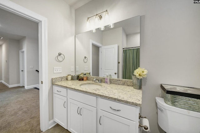 bathroom with vanity and toilet