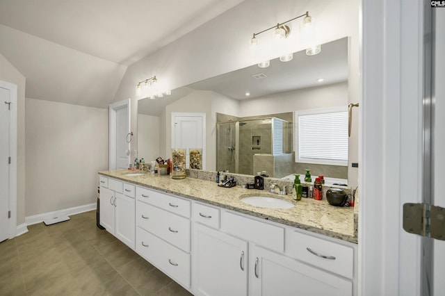 bathroom with walk in shower, tile patterned floors, vanity, and vaulted ceiling