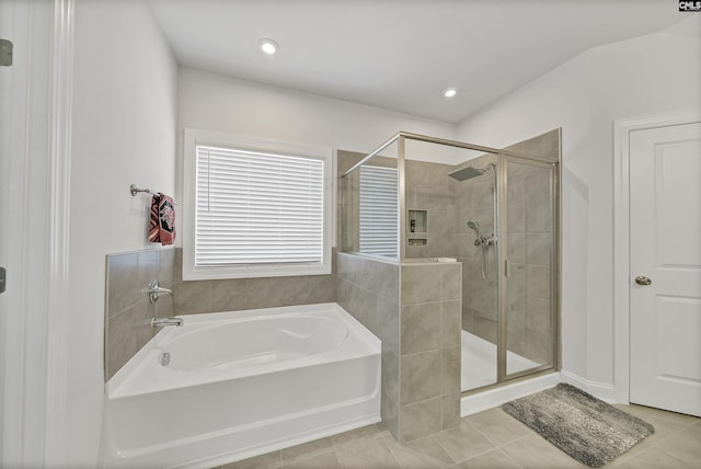 bathroom with plus walk in shower and tile patterned flooring