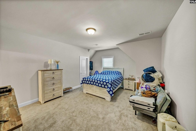 carpeted bedroom featuring lofted ceiling