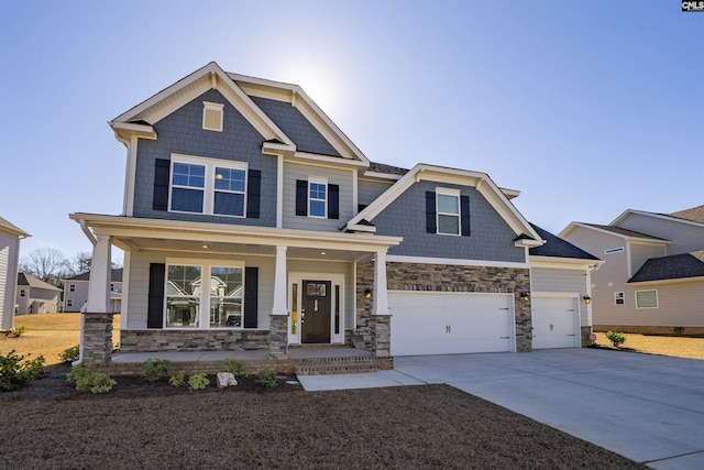 craftsman-style house with a porch and a garage