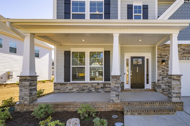 entrance to property featuring a porch