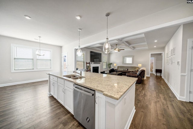 kitchen with pendant lighting, sink, dishwasher, coffered ceiling, and white cabinets