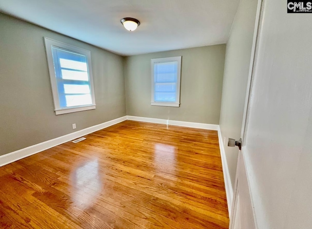 spare room featuring light hardwood / wood-style floors