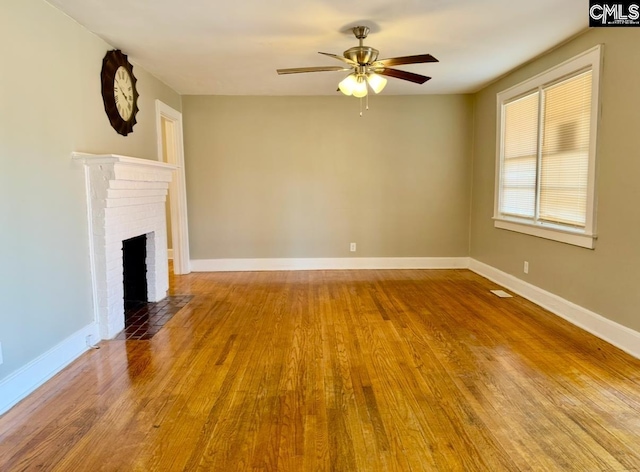 unfurnished living room with a fireplace, light hardwood / wood-style floors, and ceiling fan