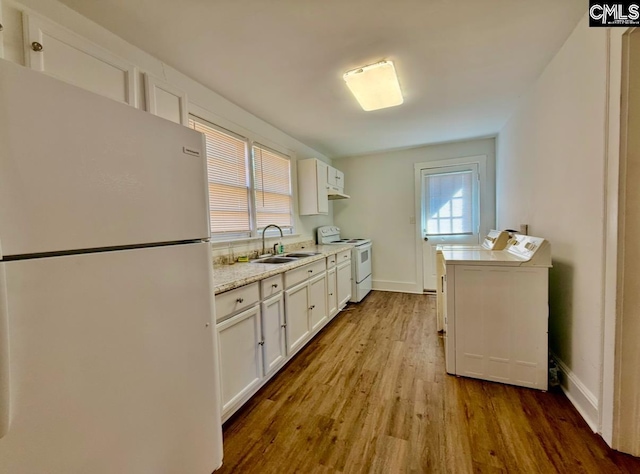 kitchen featuring white cabinetry, sink, white appliances, and light wood-type flooring