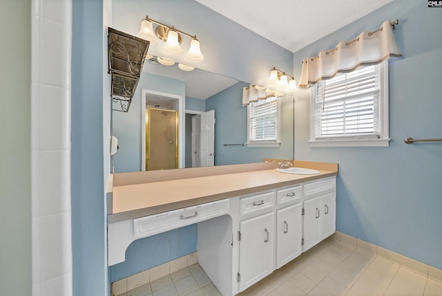 bathroom with vanity, tile patterned floors, and walk in shower