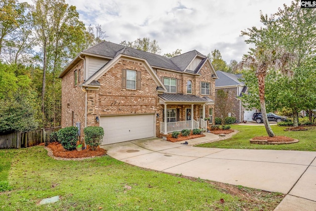 view of front of home featuring a garage, covered porch, and a front lawn