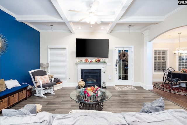 living room featuring beamed ceiling, wood-type flooring, and coffered ceiling