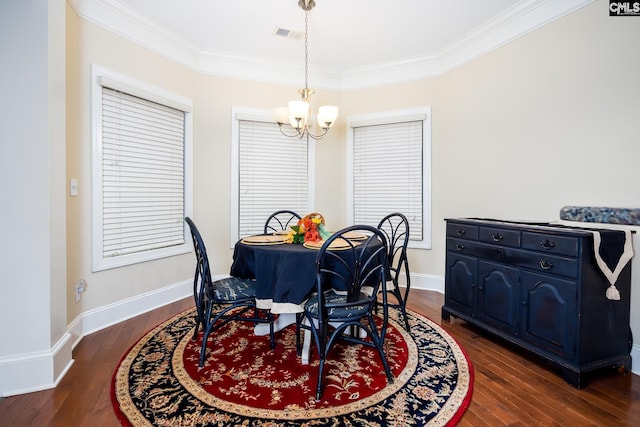 dining space featuring ornamental molding, dark hardwood / wood-style flooring, and a notable chandelier