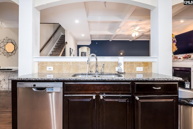 kitchen featuring sink, dark brown cabinets, light stone counters, coffered ceiling, and stainless steel dishwasher