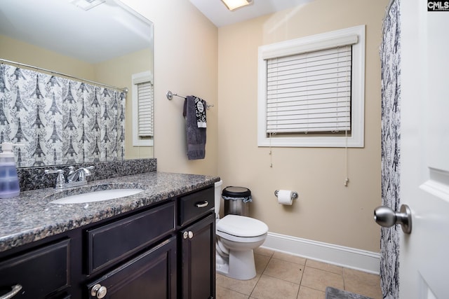 bathroom featuring vanity, tile patterned floors, and toilet