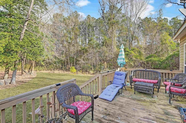 wooden deck with outdoor lounge area and a yard