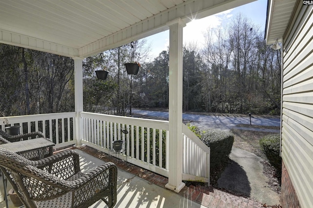 wooden terrace featuring a porch