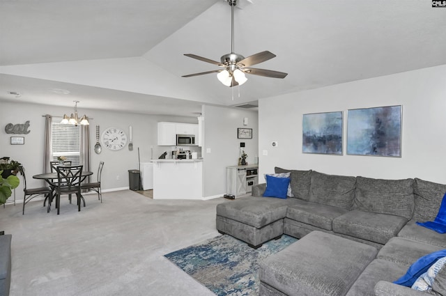 living room with vaulted ceiling, ceiling fan with notable chandelier, and carpet floors