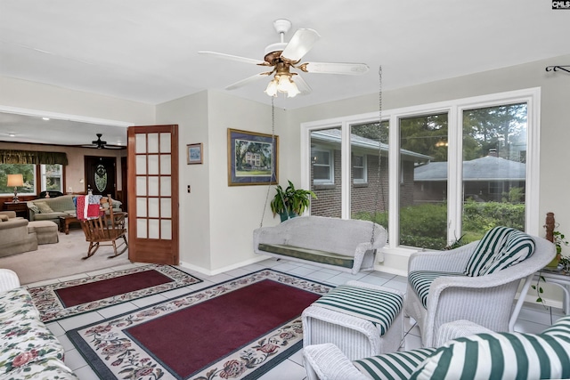 interior space featuring ceiling fan and light tile patterned floors