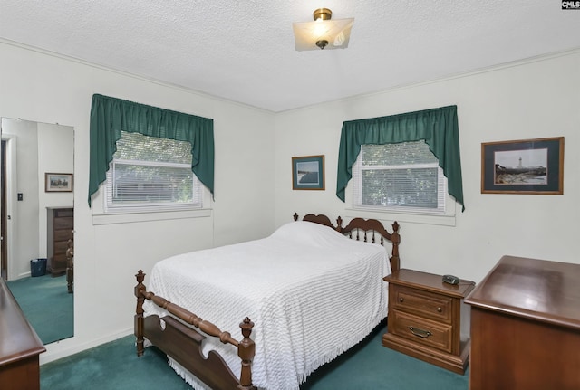 carpeted bedroom with a textured ceiling