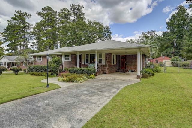 view of front of property featuring a front yard and a carport