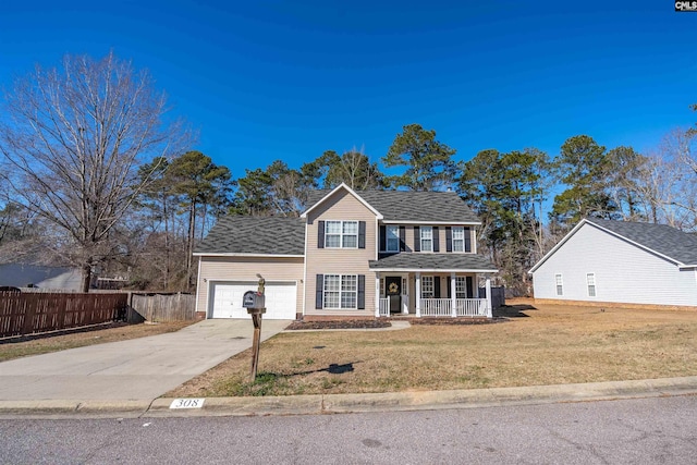 colonial home featuring a porch, a garage, and a front yard