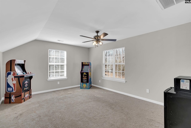 miscellaneous room featuring vaulted ceiling, plenty of natural light, light colored carpet, and ceiling fan