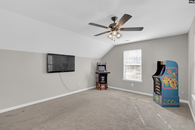 recreation room with lofted ceiling, carpet floors, and ceiling fan