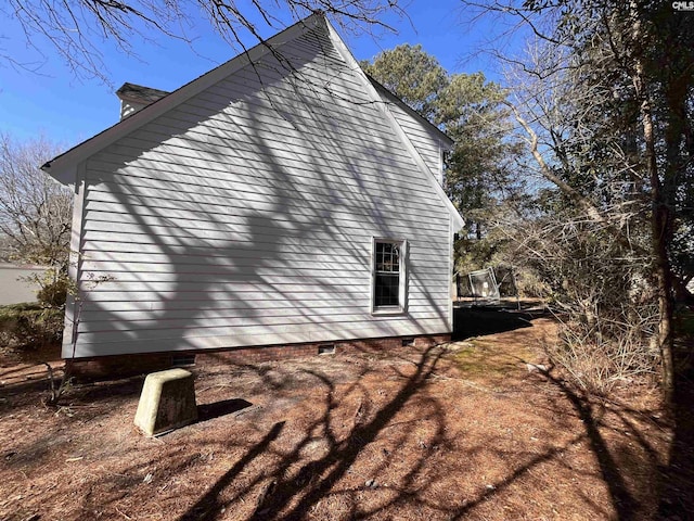 view of home's exterior featuring a trampoline