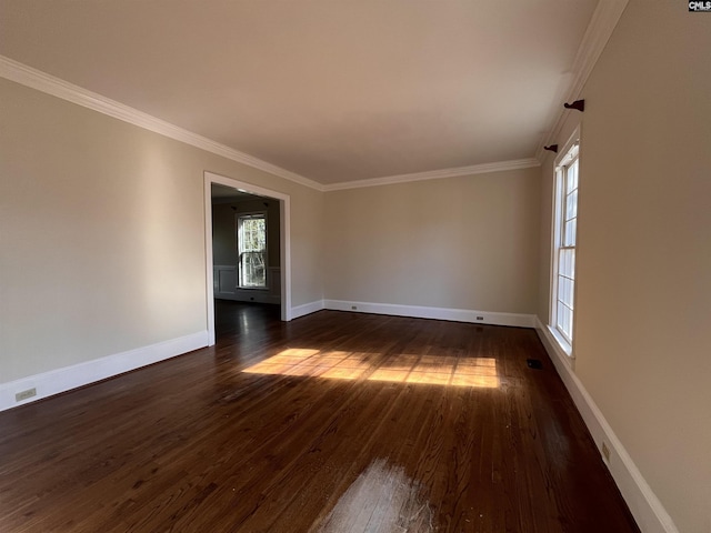 unfurnished room with crown molding and dark hardwood / wood-style flooring