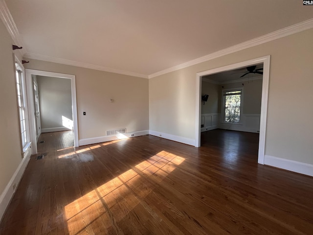 unfurnished room with dark wood-type flooring, ceiling fan, and crown molding