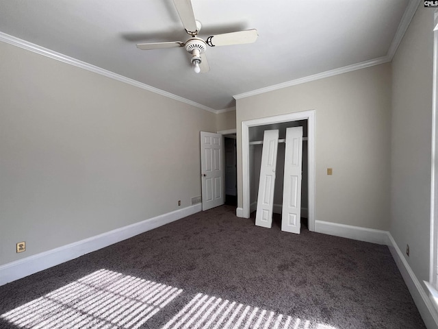 unfurnished bedroom featuring crown molding, ceiling fan, and dark colored carpet