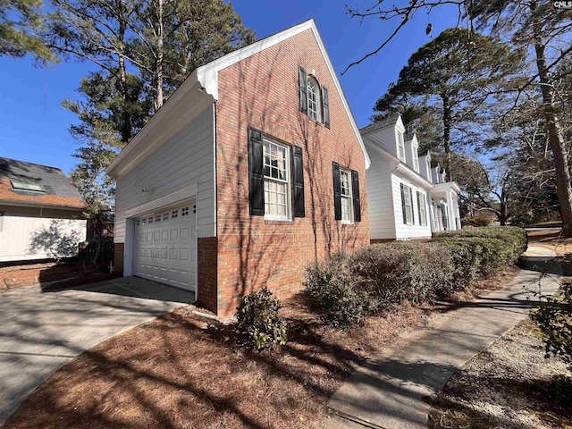 view of side of home with a garage