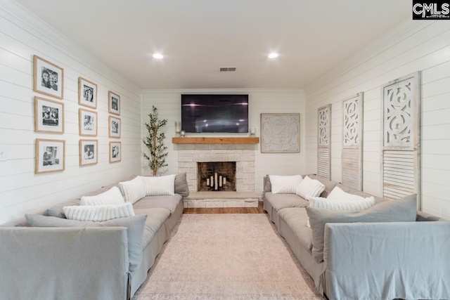 living room with a stone fireplace