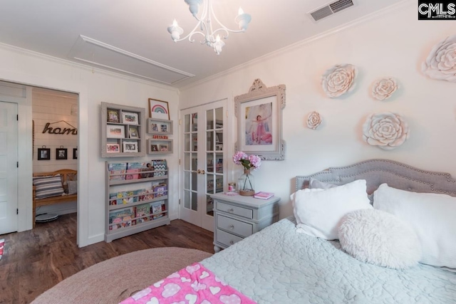 bedroom with dark wood-type flooring, ornamental molding, french doors, and a notable chandelier