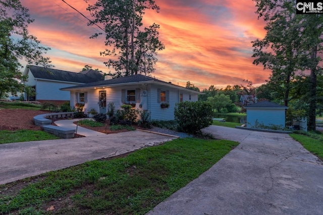 view of front of home with a yard