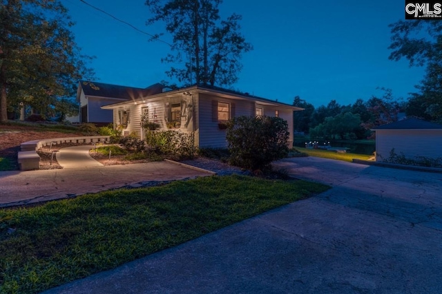 view of home's exterior with a yard