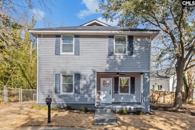 view of front of house featuring a gate, fence, and covered porch