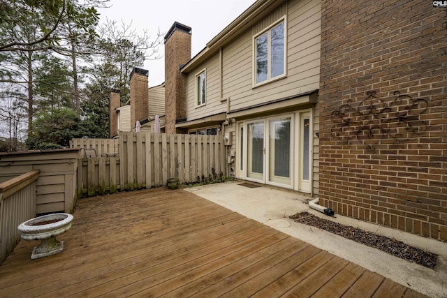 wooden terrace with a patio