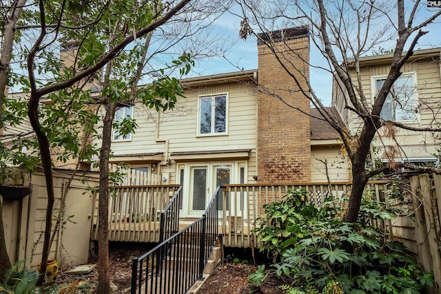 back of property featuring a wooden deck