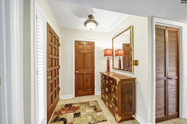 foyer entrance featuring light tile patterned floors