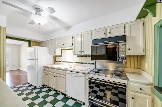 kitchen with ceiling fan, sink, white appliances, and decorative backsplash