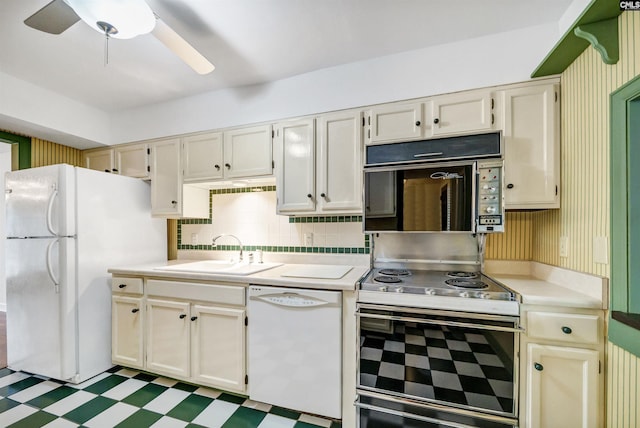 kitchen featuring ceiling fan, sink, white appliances, and decorative backsplash