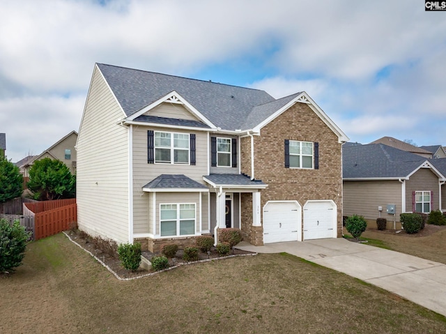 view of front of property with a garage and a front lawn