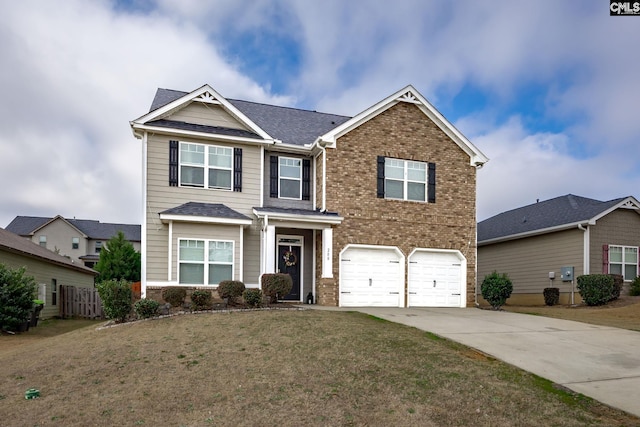 view of front of property with a garage and a front yard