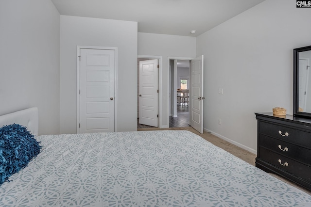 bedroom featuring light carpet