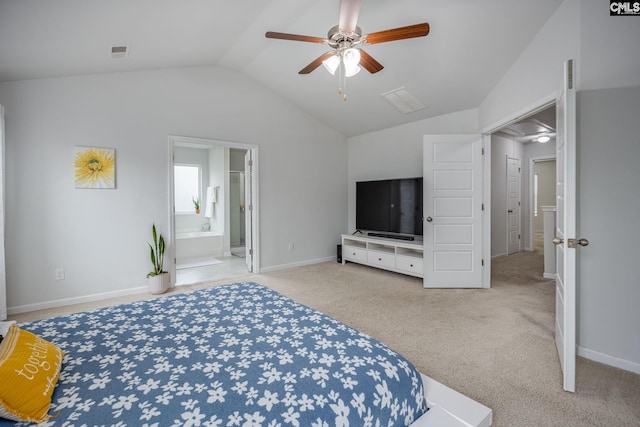 bedroom with ceiling fan, light colored carpet, lofted ceiling, and ensuite bathroom