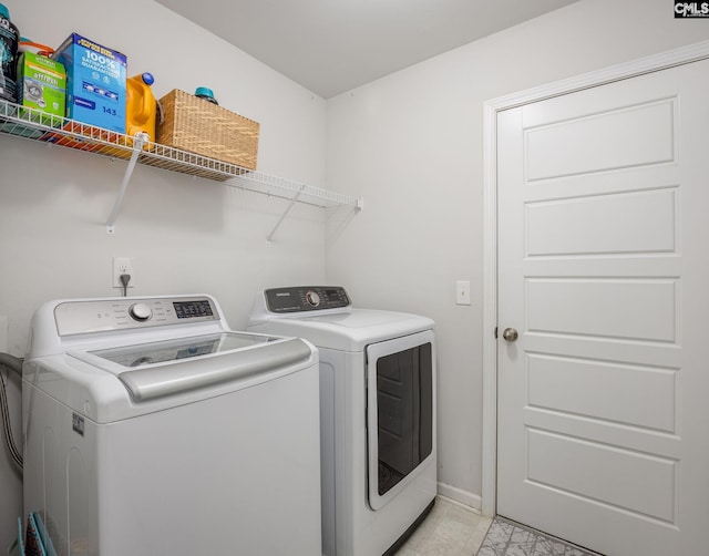 washroom with separate washer and dryer