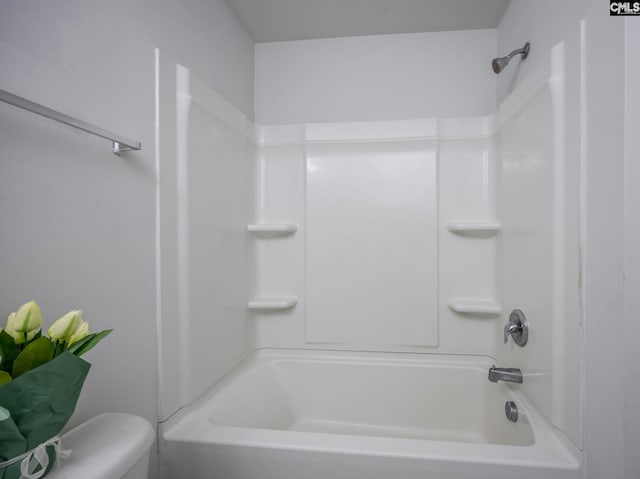 bathroom featuring toilet and shower / bath combination