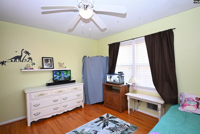 bedroom with ceiling fan and light wood-type flooring