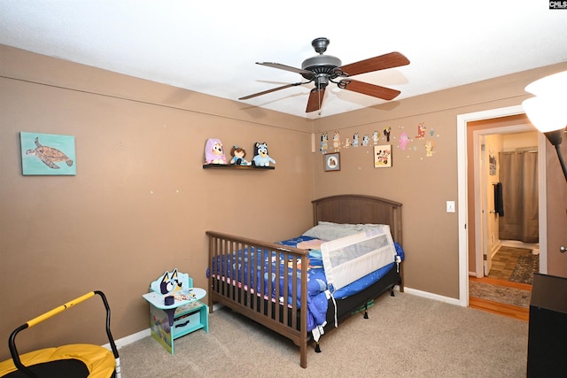 bedroom with light colored carpet and ceiling fan