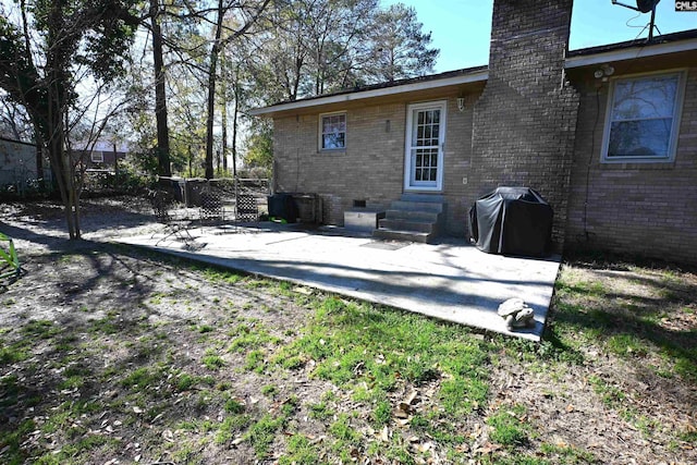 rear view of property with a patio area