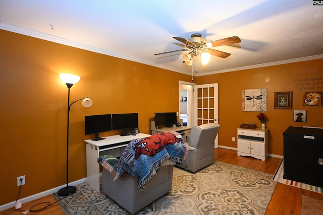 home office featuring ceiling fan, ornamental molding, and hardwood / wood-style floors